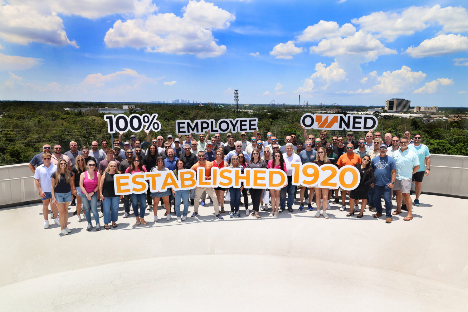 people in front of Top Golf building
