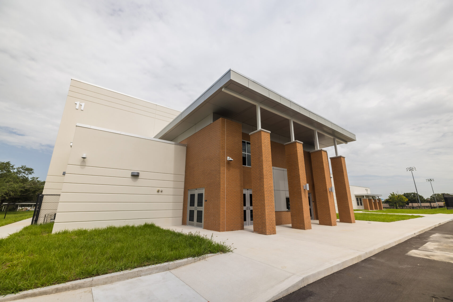 Modern brick building with double doors.